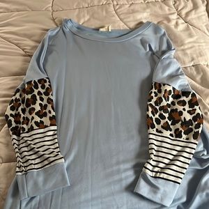 Boutique Blue 3/4 shirt. Leopard and stripe designed sleeve
